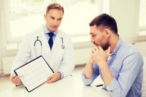 Male doctor with male patient